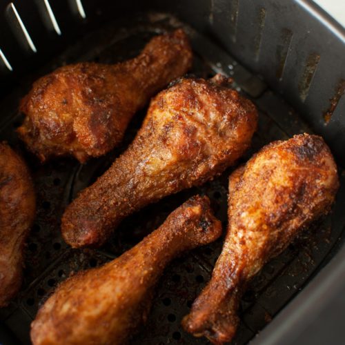 Fried Chicken Legs at the bottom of an air fryer