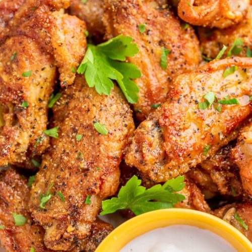 wet Lemon Pepper Chicken Wings with ranch dip on the side