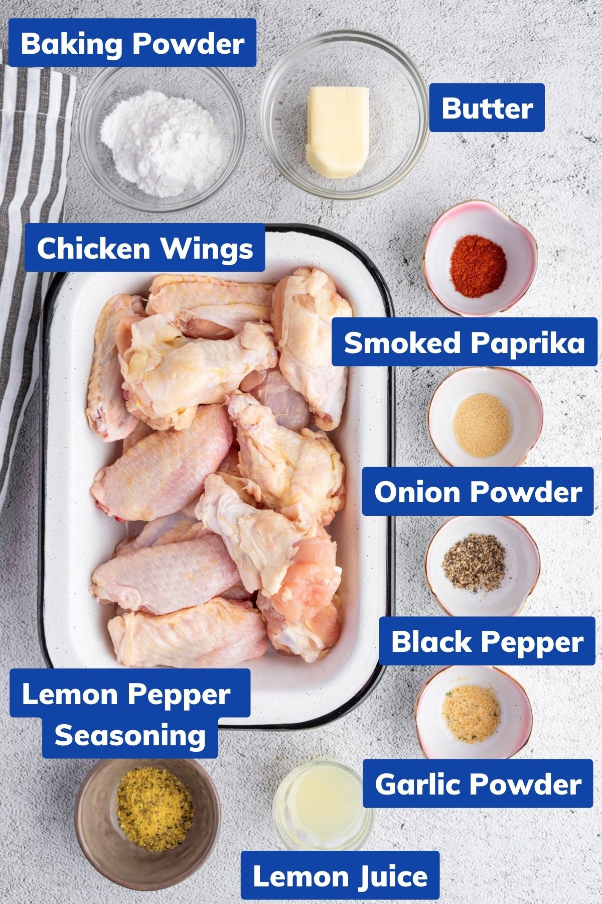 baking powder, butter, chicken wings, smoked paprika, onion powder, garlic powder, black pepper, garlic powder, lemon juice and lemon pepper seasoning on separate bowls