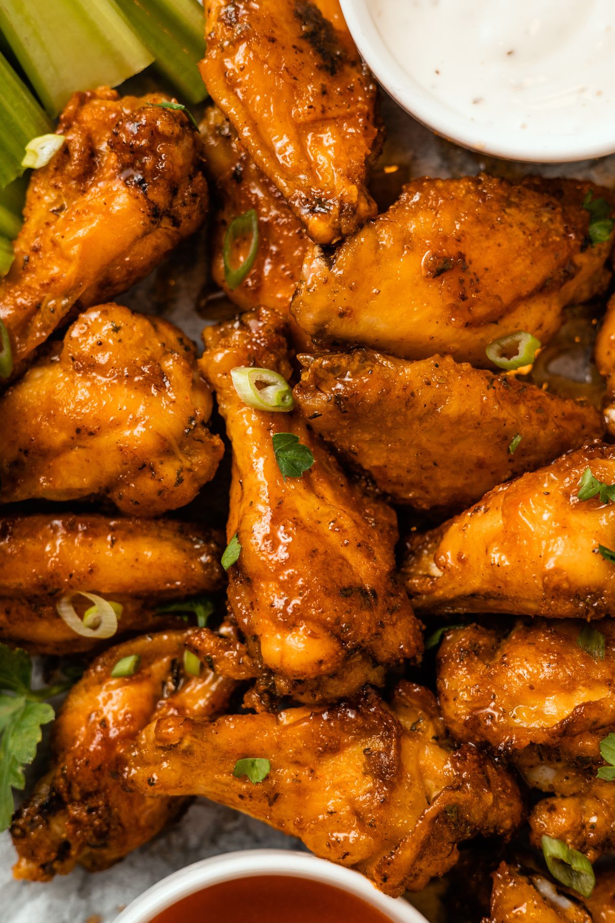 juicy Honey Buffalo Wings (hot honey wings) with crispier skin on a tray with sauce