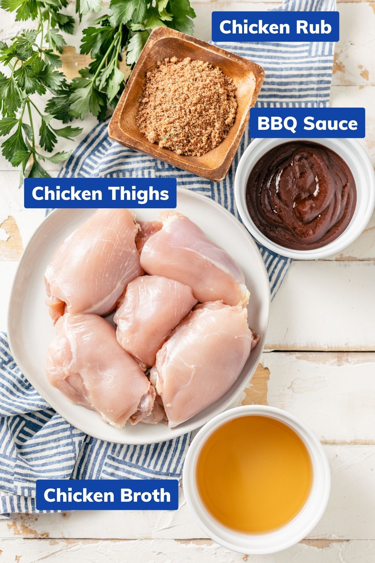 bbq chicken rub, chicken thighs, bbq sauce, and chicken broth in separate bowls