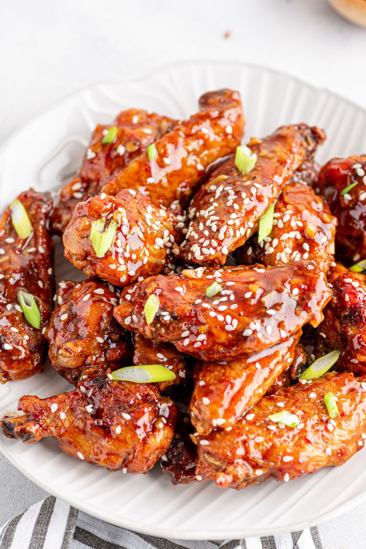 juicy Sweet Chili Wings topped with some sesame seeds and green onions