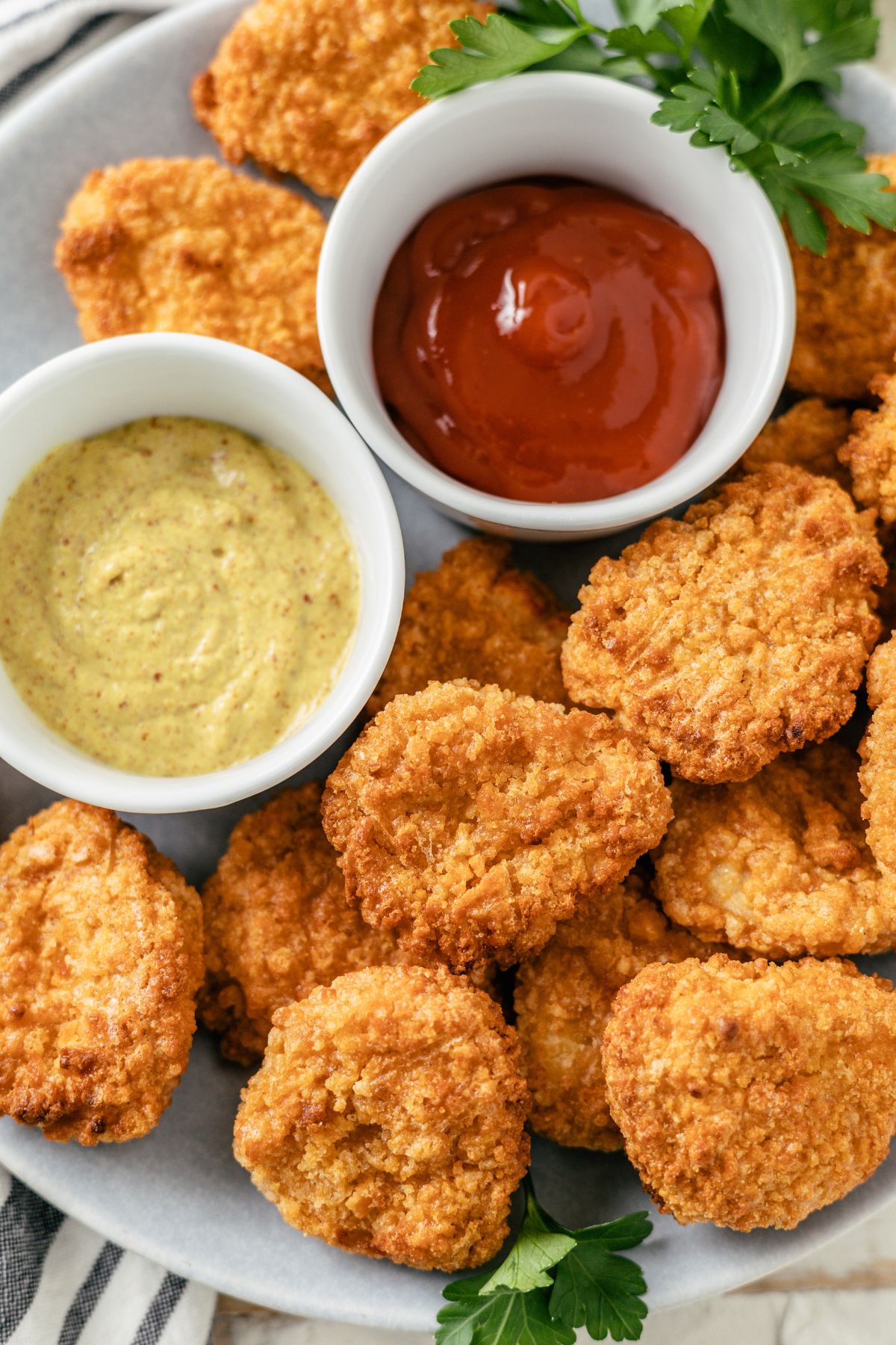 Air Fryer Frozen Chicken Nuggets with ketchup and mayo dip