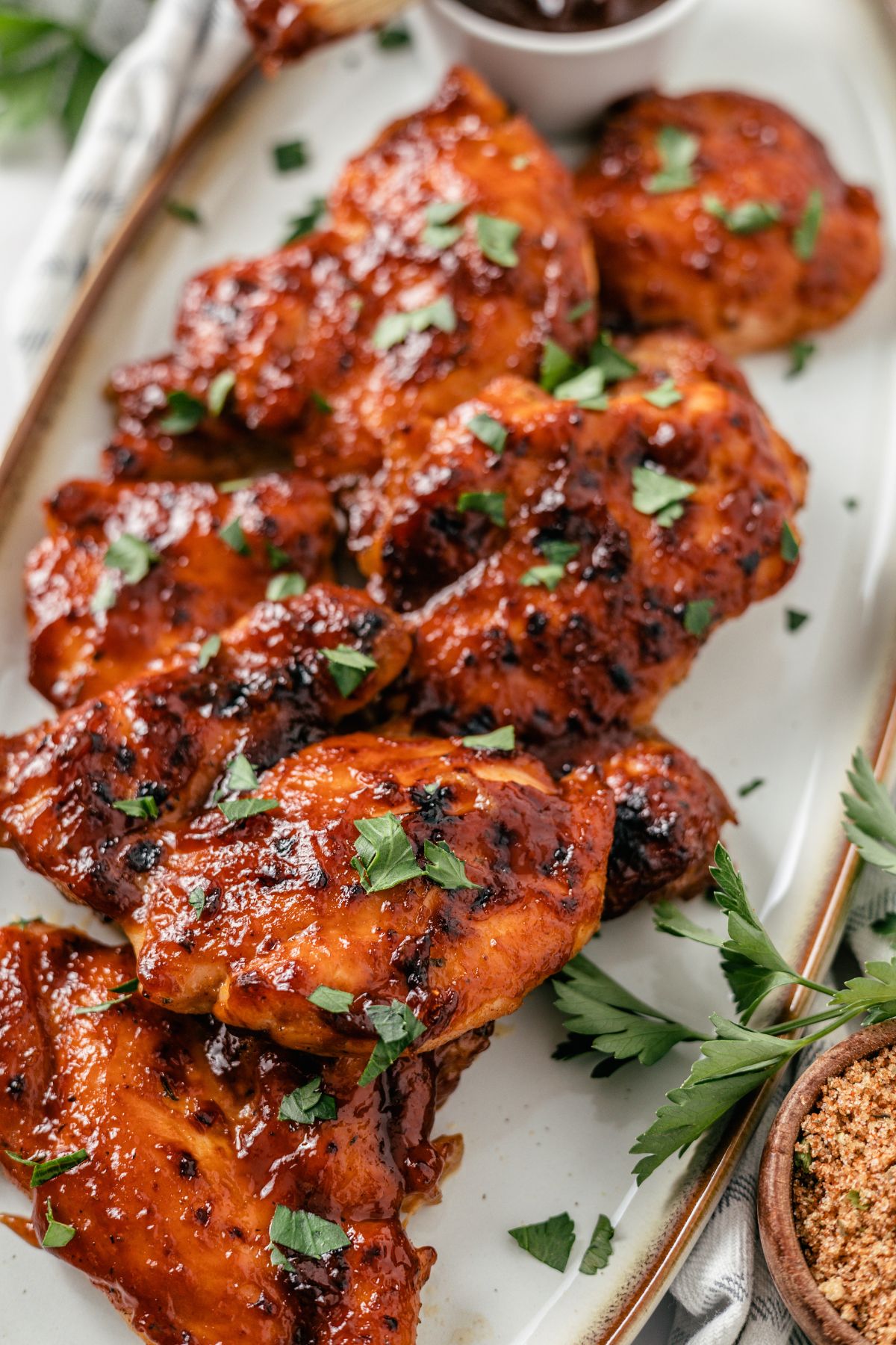 close-up look of Baked BBQ Chicken Thighs on a long plate