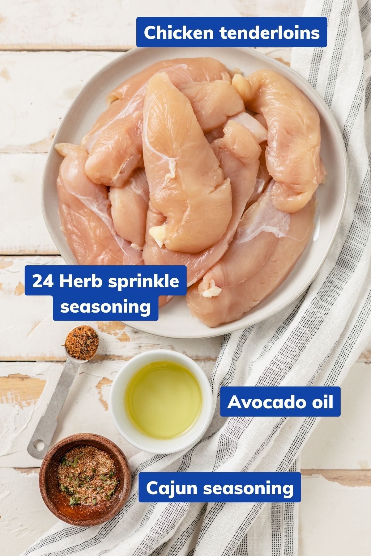 Chicken tenderloins, Cajun seasoning, herb sprinkle seasoning, and avocado oil in separate bowls.