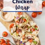 4 Cajun Chicken Wraps with spicy mayo dip, beautifully presented with a side of cherry tomatoes