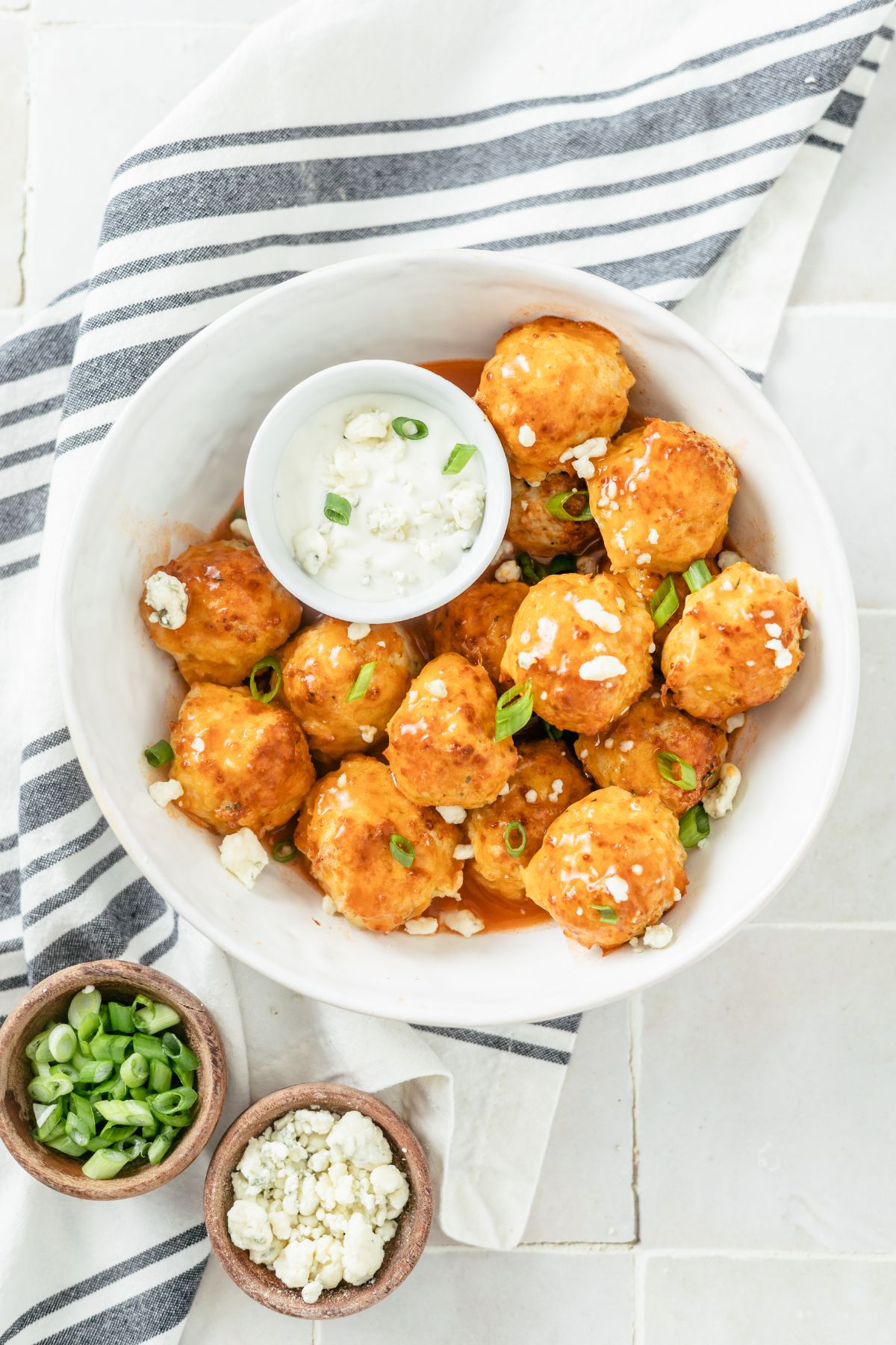 Savory Buffalo Chicken Meatballs with a blue cheese dressing in a bowl