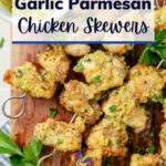 Juicy Garlic Parmesan Chicken Skewers plated with a side bowl of rich garlic Parmesan sauce, accented with a sprinkle of fresh parsley