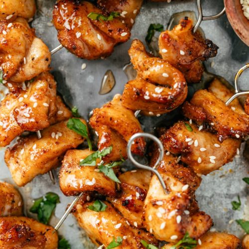 Juicy chicken skewers cooked to perfection in an air fryer with a golden-brown exterior.